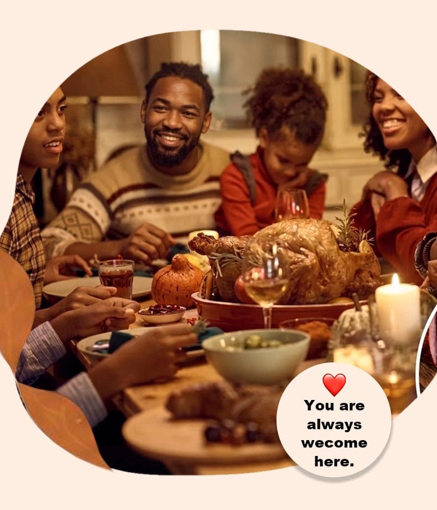 Friends sharing a warm Nigerian meal together